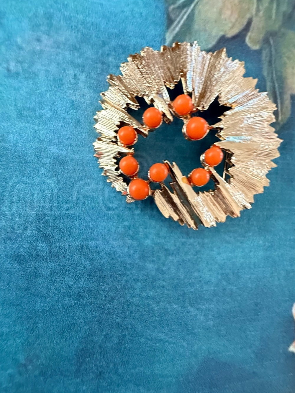 Floral brooch with Orange Beads.